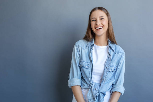 istock Young woman free style isolated on grey 1143998168