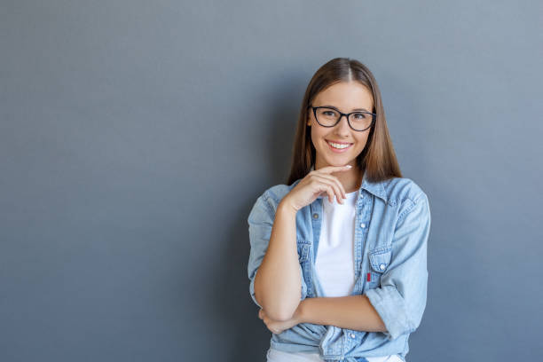 istock Young woman free style isolated on grey 1143998177