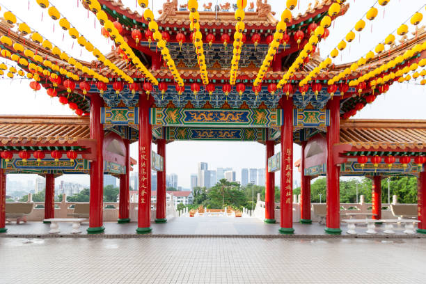 Thean Hou Temple gates, and skyscreapers skyline in Kuala Lumpur