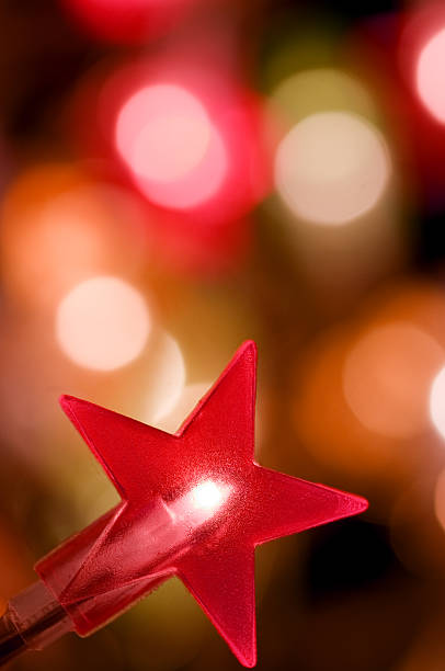 istock Star shaped christmas light with defocussed background 114400017