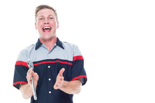 istock Attractive young male mechanic standing on white background - clapping 1144000859
