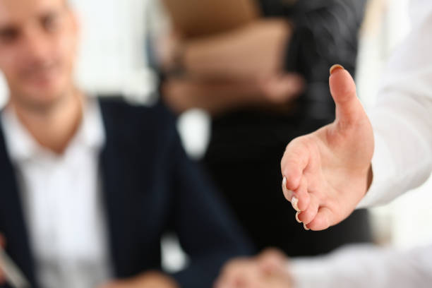 istock Businesswoman offer hand to shake as hello in office 1144033242