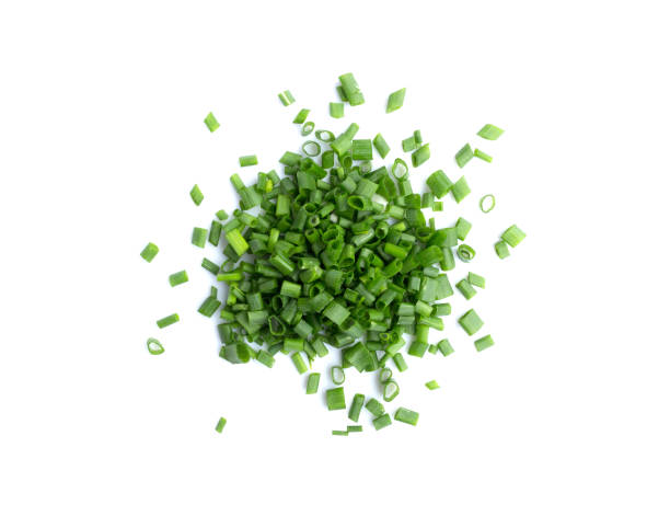 istock Chopped green onions or scallions placed on white background 1144033344