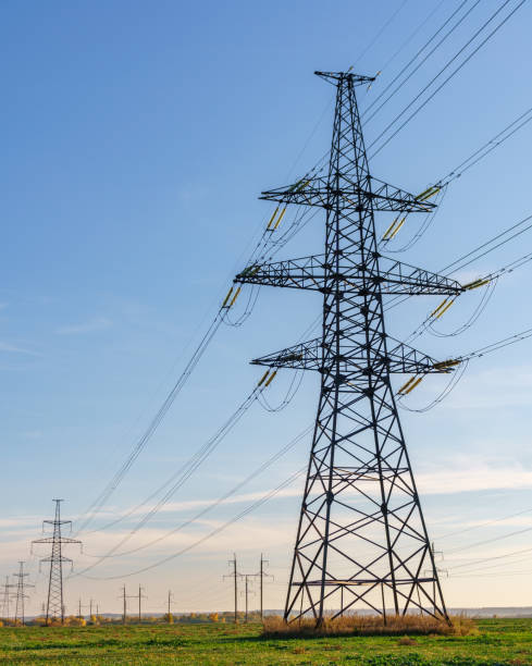 istock Supports high-voltage power lines against the blue sky. Electrical industry. 1144034478