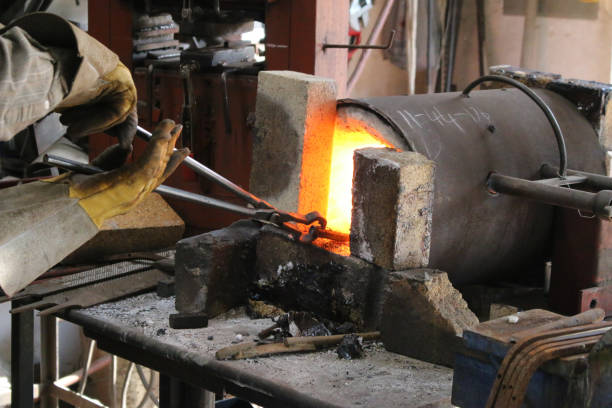istock A piece of steel being worked with in a hot forge 1144036234