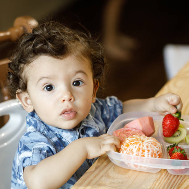 istock Baby eating fruits and vegetables 1144036250