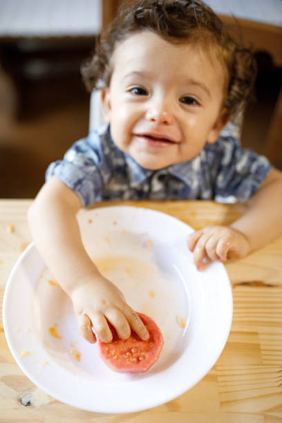 istock Baby eating fruits and vegetables 1144036320
