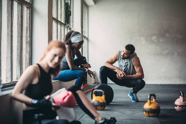 istock Trainer and female client talking in gym 1144036326