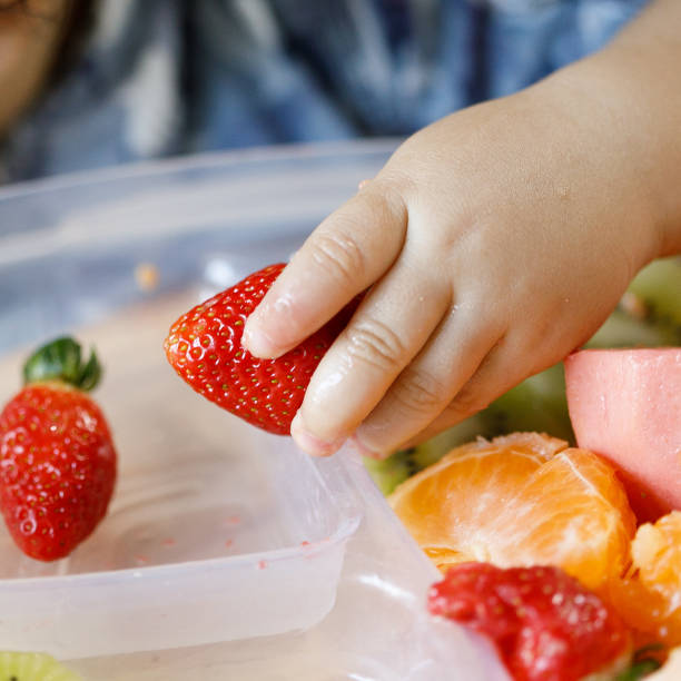 istock Baby eating fruits and vegetables 1144036329