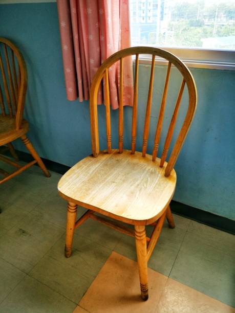 istock Wooden chair at windows 1144050835