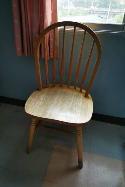 istock Wooden chair at windows 1144050843