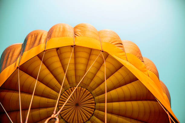 globo de aire caliente naranja - burmese culture fotografías e imágenes de stock