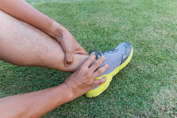 istock Sports Man Runner with injured ankle while training in the Stadium 1144059167