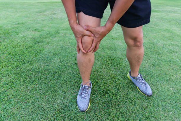 istock Tendon knee joint problems on Man's leg from exercise In the stadium. 1144059206