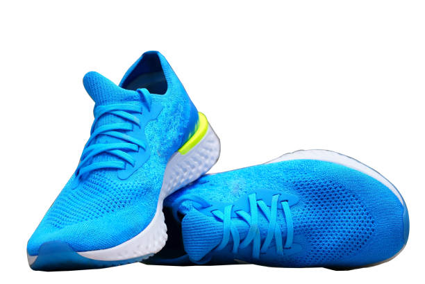 blue runnung or sport shoes on isolated white background stock photo