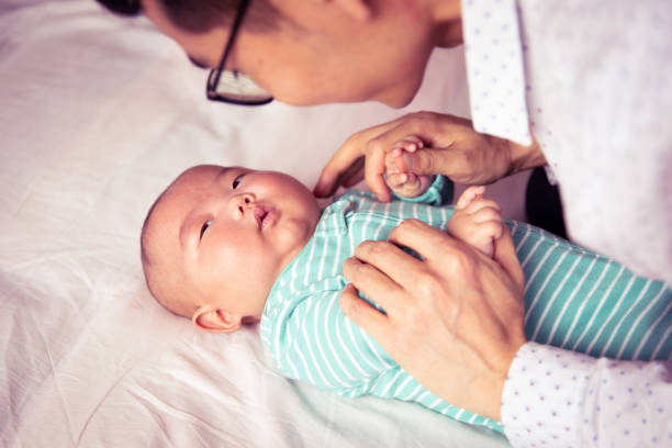istock Father holding his newborn baby 1144065895