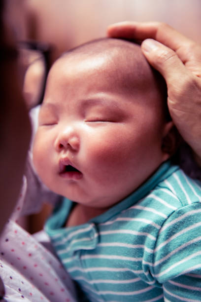 istock Father holding his newborn baby 1144065927