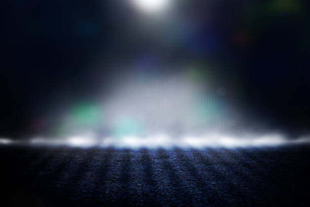 istock Spotlight over concrete floor. dark black background 1144070407