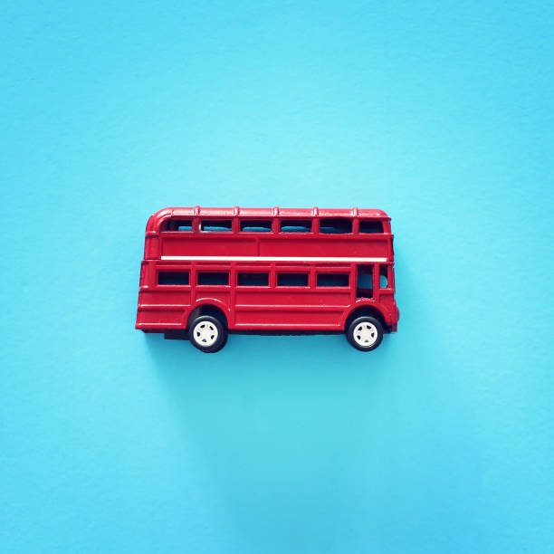 London traditional red double decker bus over blue background. London traditional red double decker bus over blue background. London Memorabilia stock pictures, royalty-free photos & images