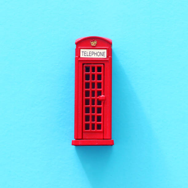 London traditional red phone booth over blue background. London traditional red phone booth over blue background. London Memorabilia stock pictures, royalty-free photos & images