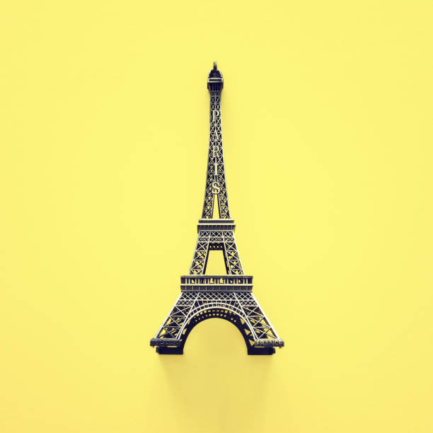 istock Paris symbol Eiffel Tower over yellow background 1144070479