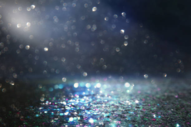 istock glitter vintage lights background. black, blue and silver. de-focused 1144070510