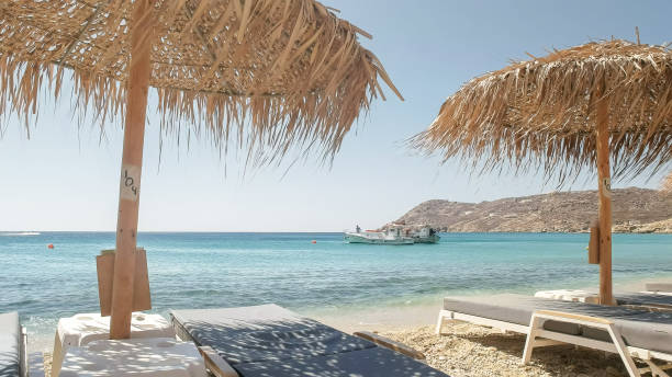istock beach chairs at elia beach on mykonos, greece 1144078137