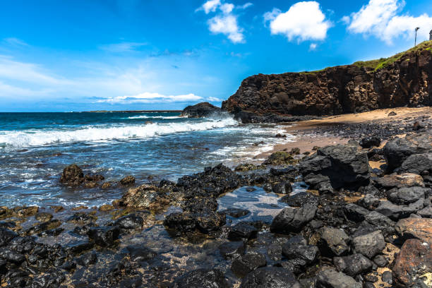 View of lava rocks and the ocean along Hanapepe Bay coast, Kauai, Hawaii