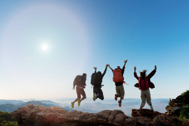istock Group of happy hiker jumping on the hill 1144087536