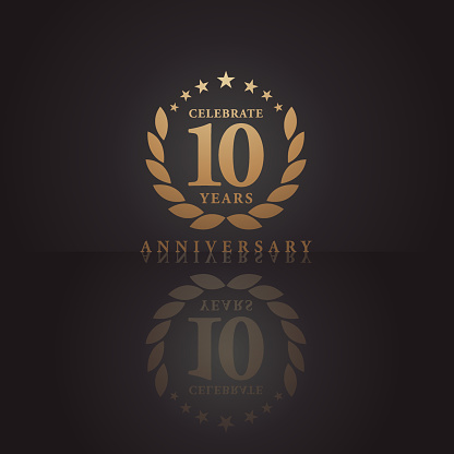 Vector of Ten years golden anniversary icon with dark color background. EPS Ai 10 file format.