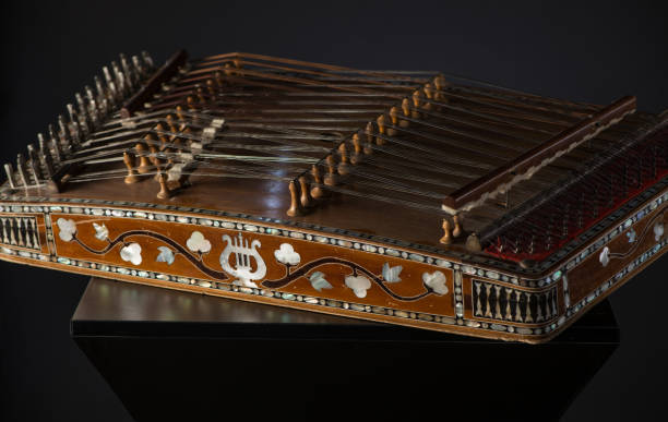 national musical instrument of Asia ancient Asian stringed musical instrument on black background with backlight. the similarity of the harp and psaltery psaltery stock pictures, royalty-free photos & images