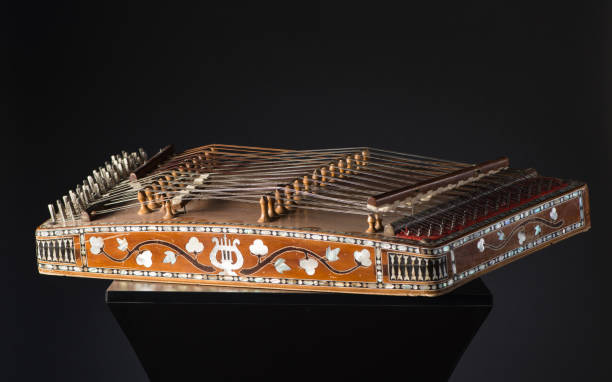 national musical instrument of Asia ancient Asian stringed musical instrument on black background with backlight. the similarity of the harp and psaltery psaltery stock pictures, royalty-free photos & images