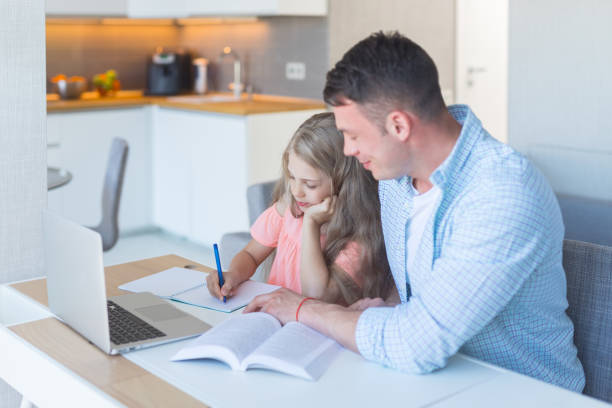 istock Young family doing homework 1144094060