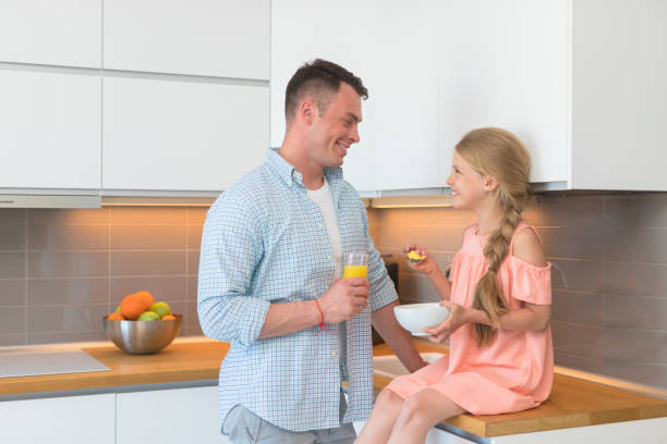 istock Young father and daughter having breakfast 1144094214