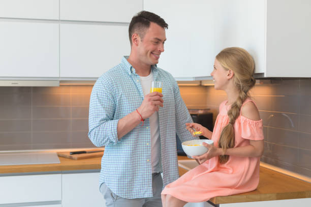 istock Young father and a little daughter have a breakfast 1144094219