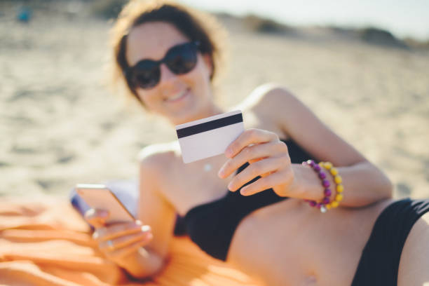 istock Online shopping at the beach 1144097642