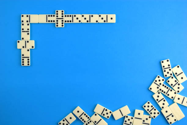 istock Dominoes on blue background. 1144103087