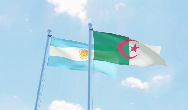 istock Argentina and Algeria, two flags waving against blue sky 1144108310
