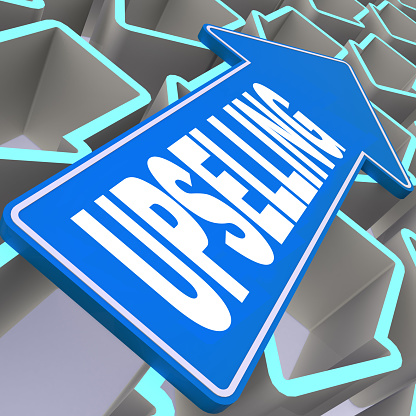 Upselling word with blue arrow, 3D rendering