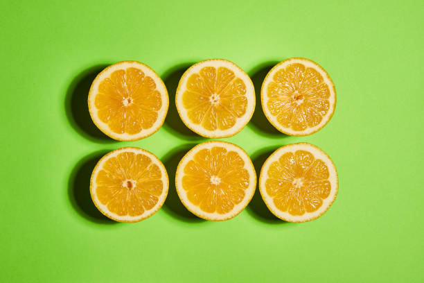 istock Lemon on green background. Flat lay, top view, copy space . Food concept. 1144111010