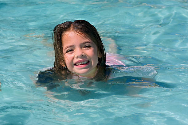 istock dark haired girl swimming 114411306