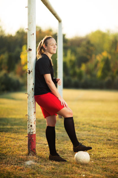 istock Female soccer player resting 1144114274
