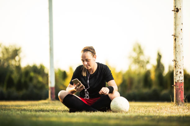 istock Happy female soccer player resting 1144114439