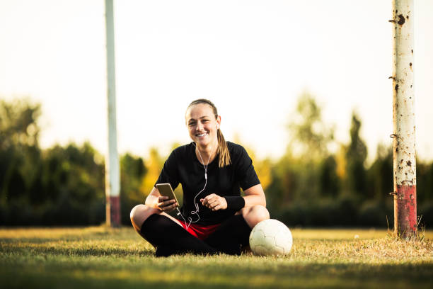 istock Happy female soccer player resting 1144115851
