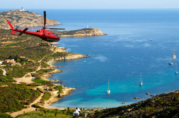 istock Helicopter flying over beach, Corsica, Europe. 1144116863