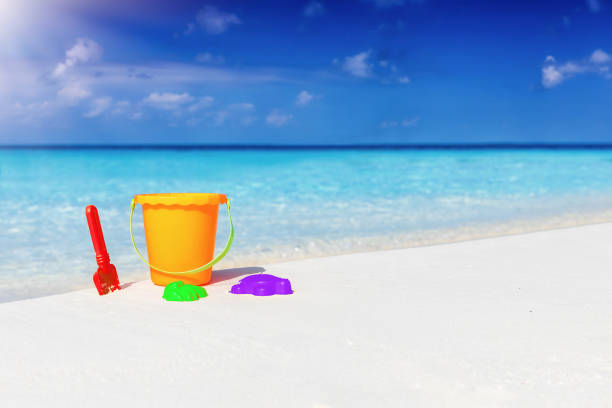 istock Colorful toys on a tropical beach 1144124618