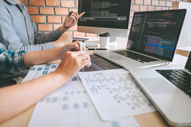 istock Team of Professional Developer programmer cooperation meeting and brainstorming and programming in website working a software and coding technology, writing codes and database 1144131733
