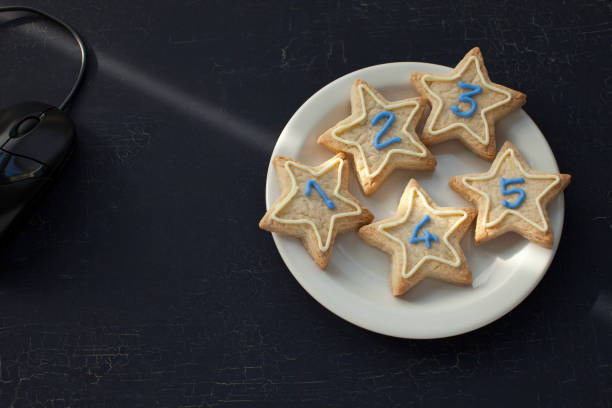 Star rating. Place of work. Gift of star shaped shortbread cookies with numbers one to five in icing.
