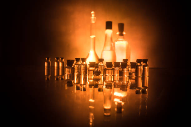 istock Pharmacy and chemistry theme. Test glass flask with solution in research laboratory. Science and medical background. Laboratory test tubes on dark toned background 1144132977