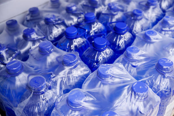 istock Lid plastic water bottle in the market. multi-colored plastic bottle caps 1144134349